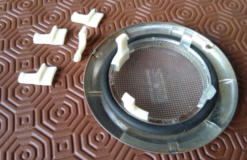 3D printed retainer clips as printed and glued into light fitting